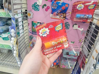 hand holding a ryan's world lip balm