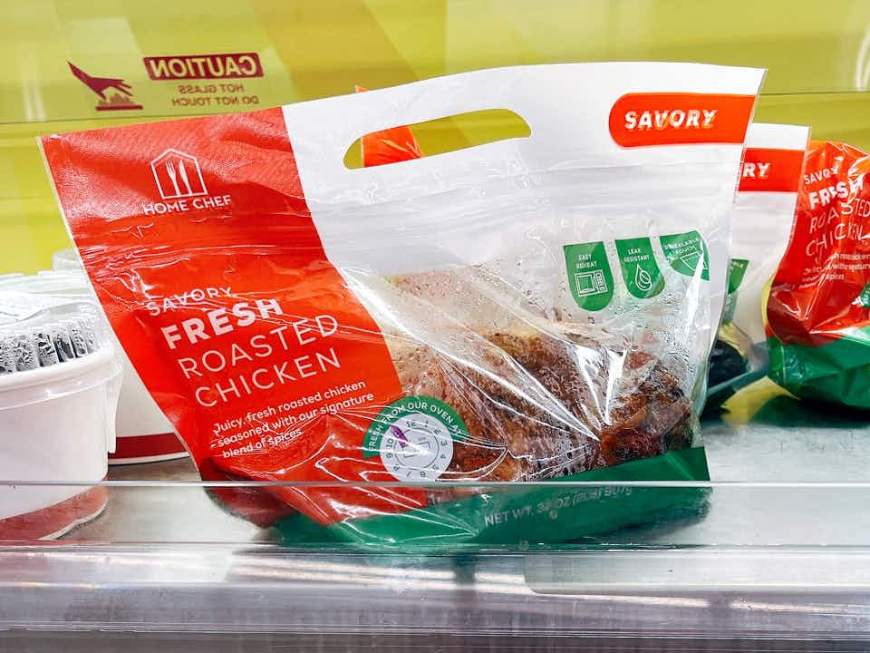 A packaged rotisserie chicken on a hot shelf inside Food4Less, a Kroger store.
