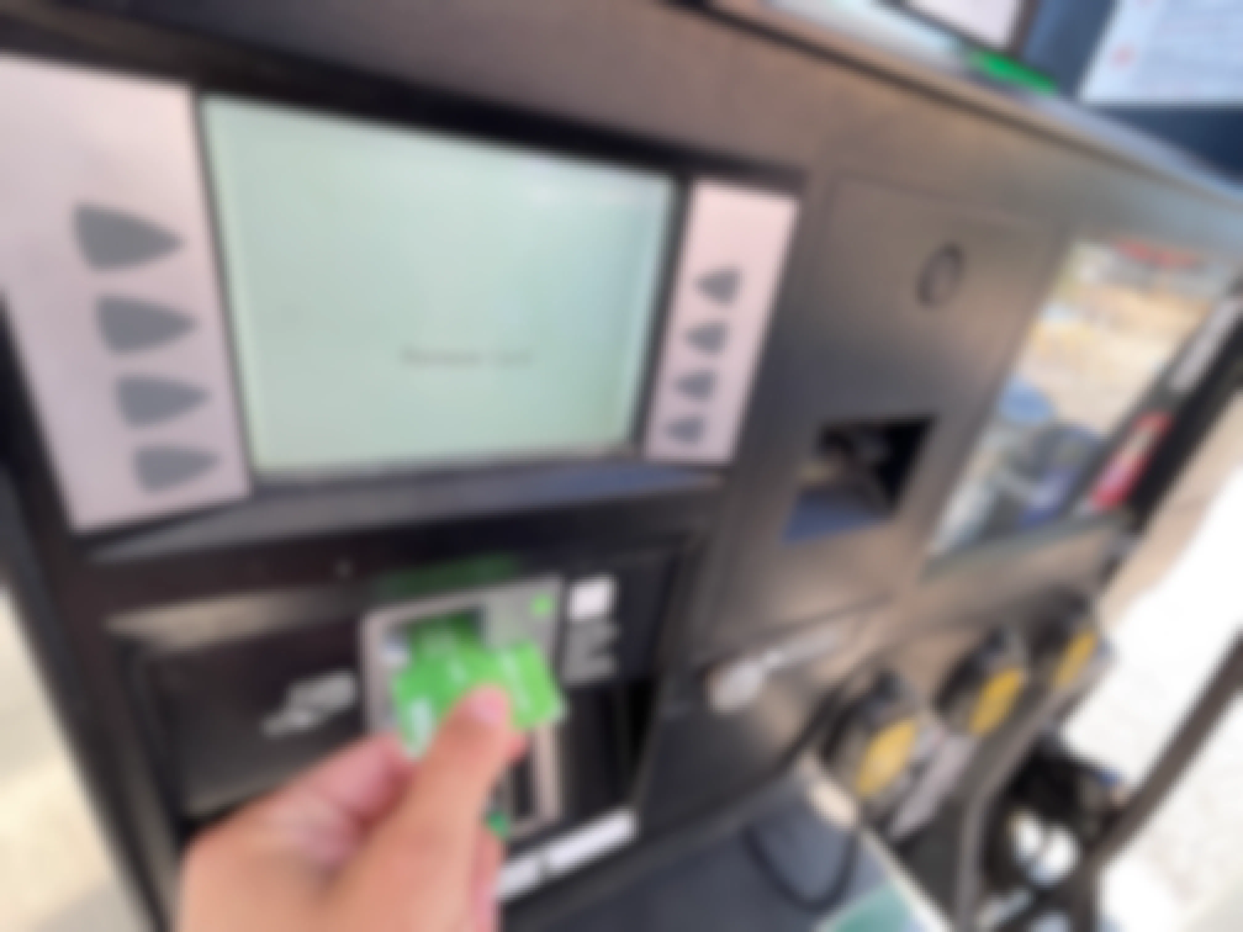 putting card into reader at gas pump