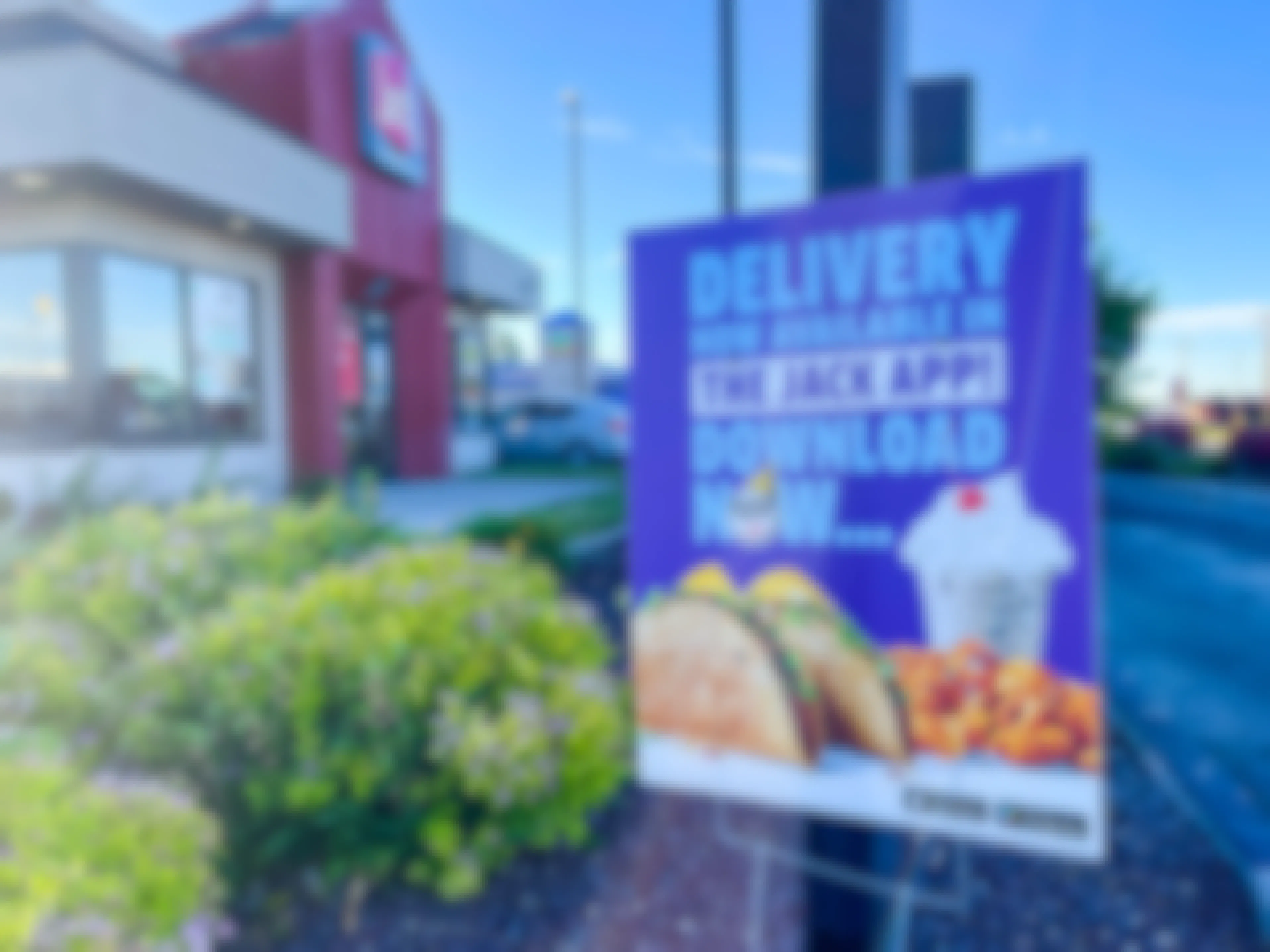 delivery with the jack in the box app sign outside store 