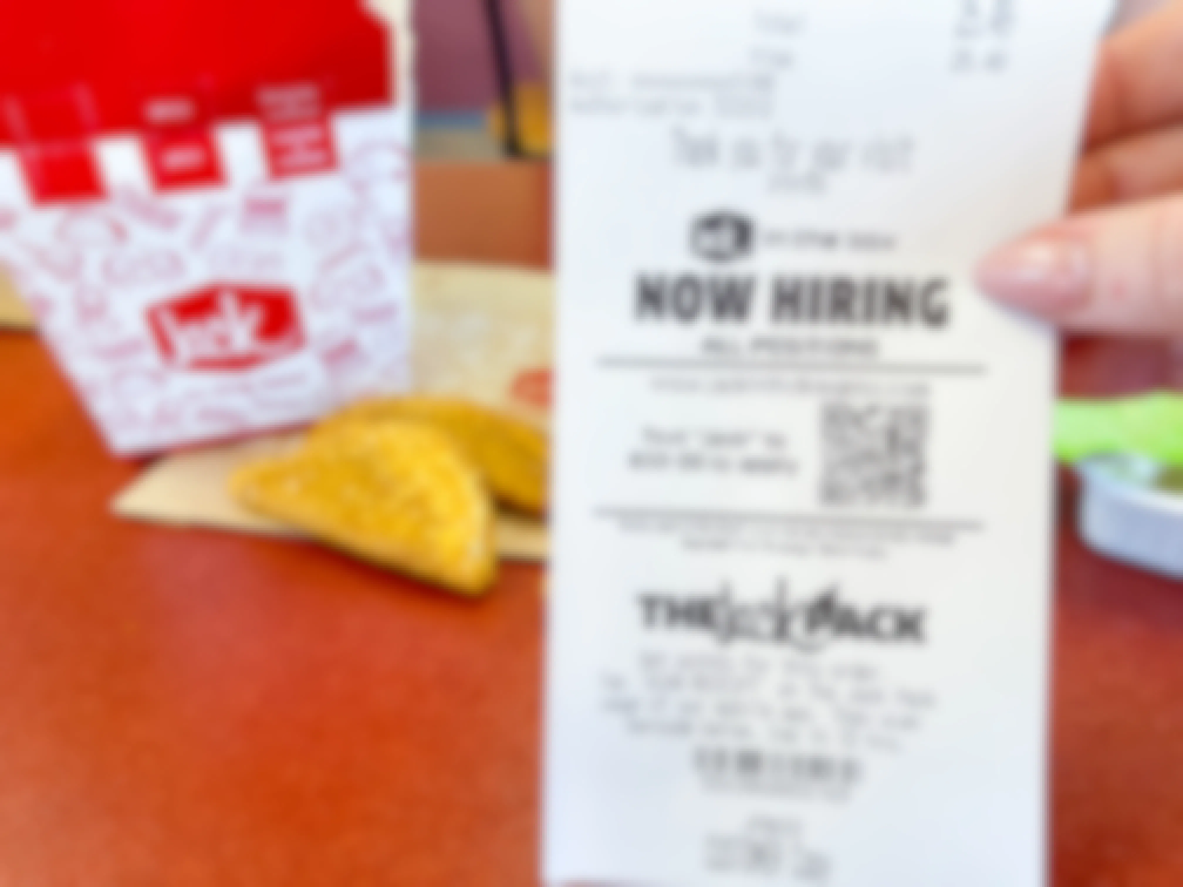 now hiring on receipt next to jack in the box tacos box