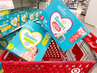 Two boxes of Pampers diapers stacked in a Target shopping cart