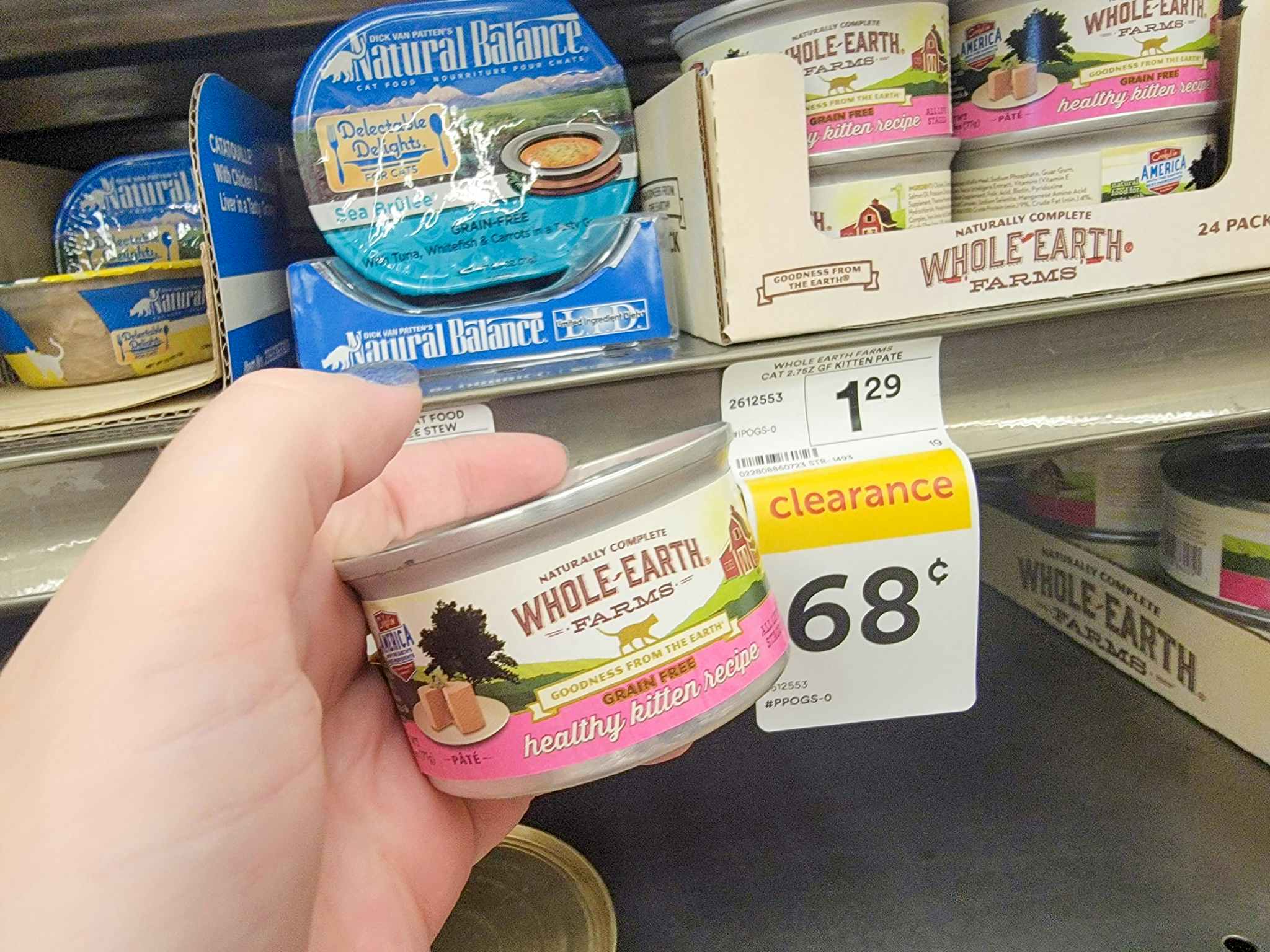 hand holding a can of whole earth farms healthy kitten cat food