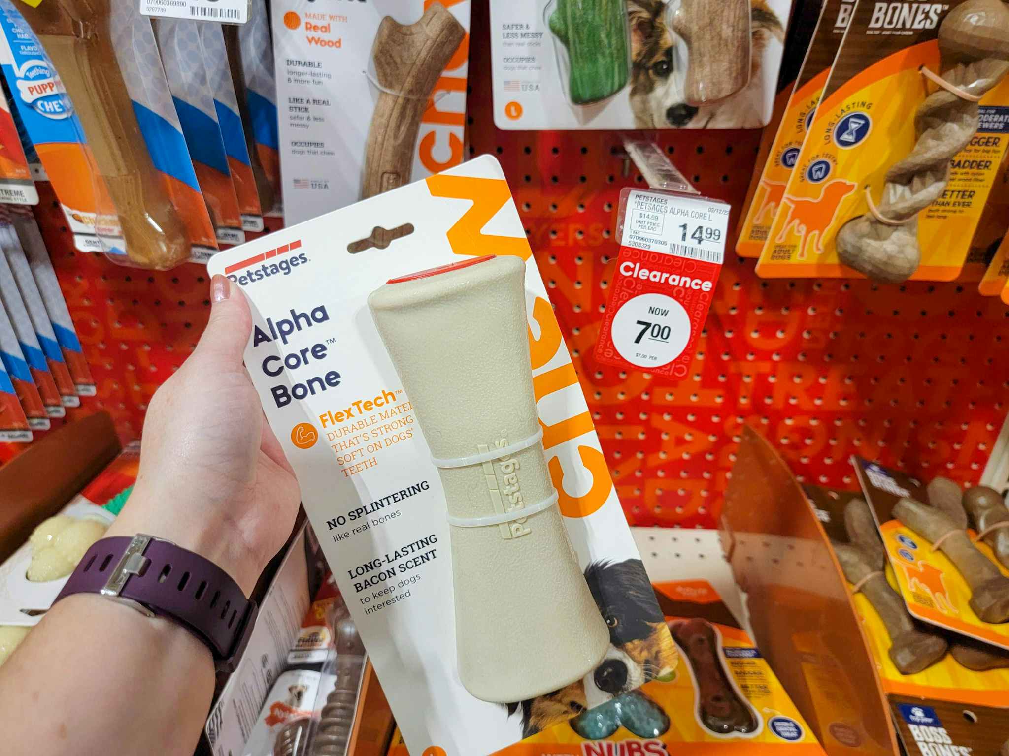 hang holding a dog chew at PetSmart