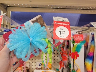 Hand holding a clearance cat toy at PetSmart