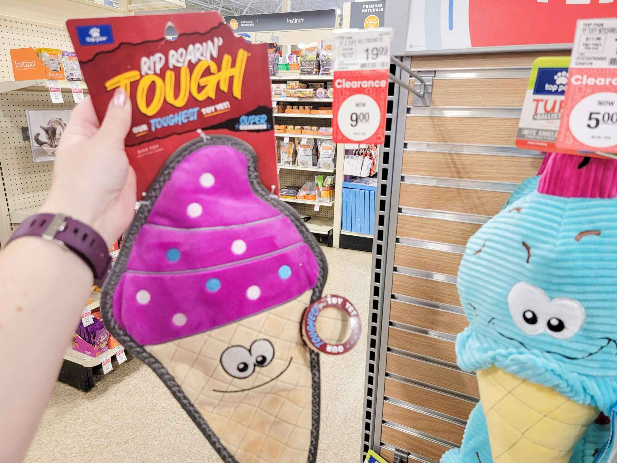 hand holding an ice cream cone dog toy at PetSmart