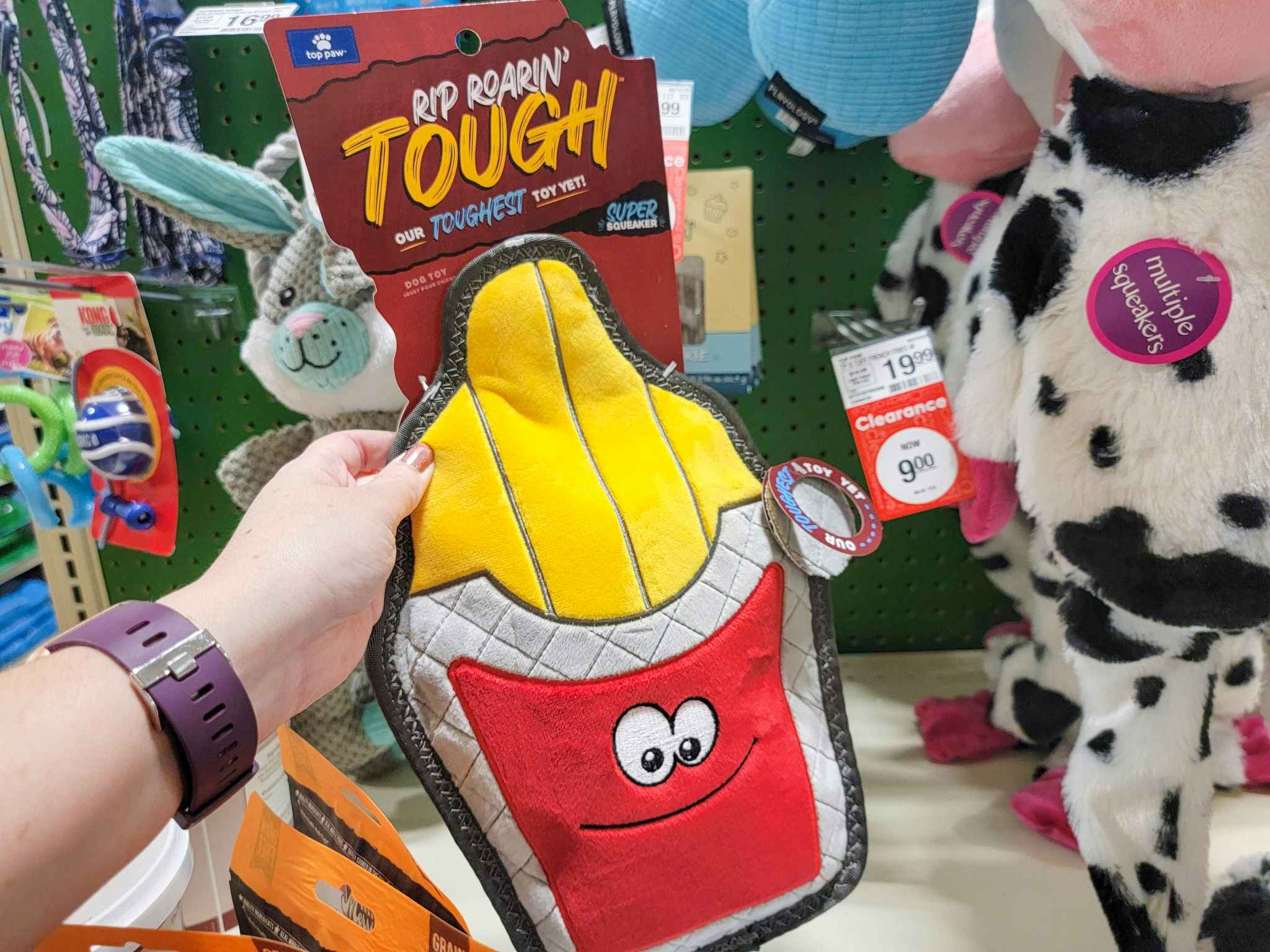 hand holding a durable french fry dog toy