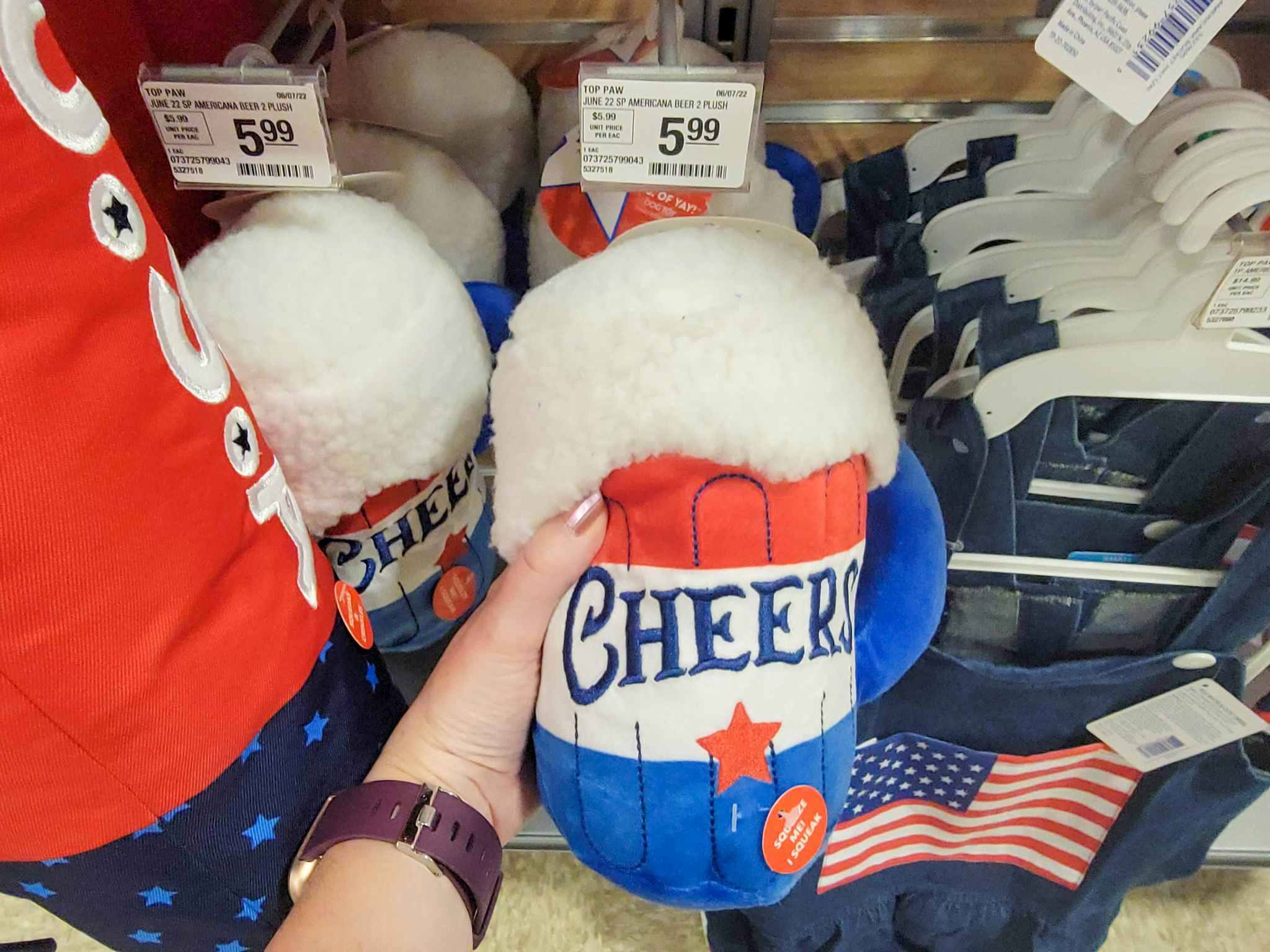 hand holding Fourth of July dog beer mug toy