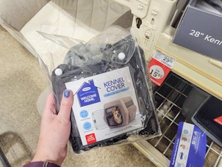 hand holding a kennel cover