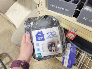 hand holding a kennel cover