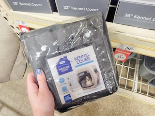 hand holding a kennel cover