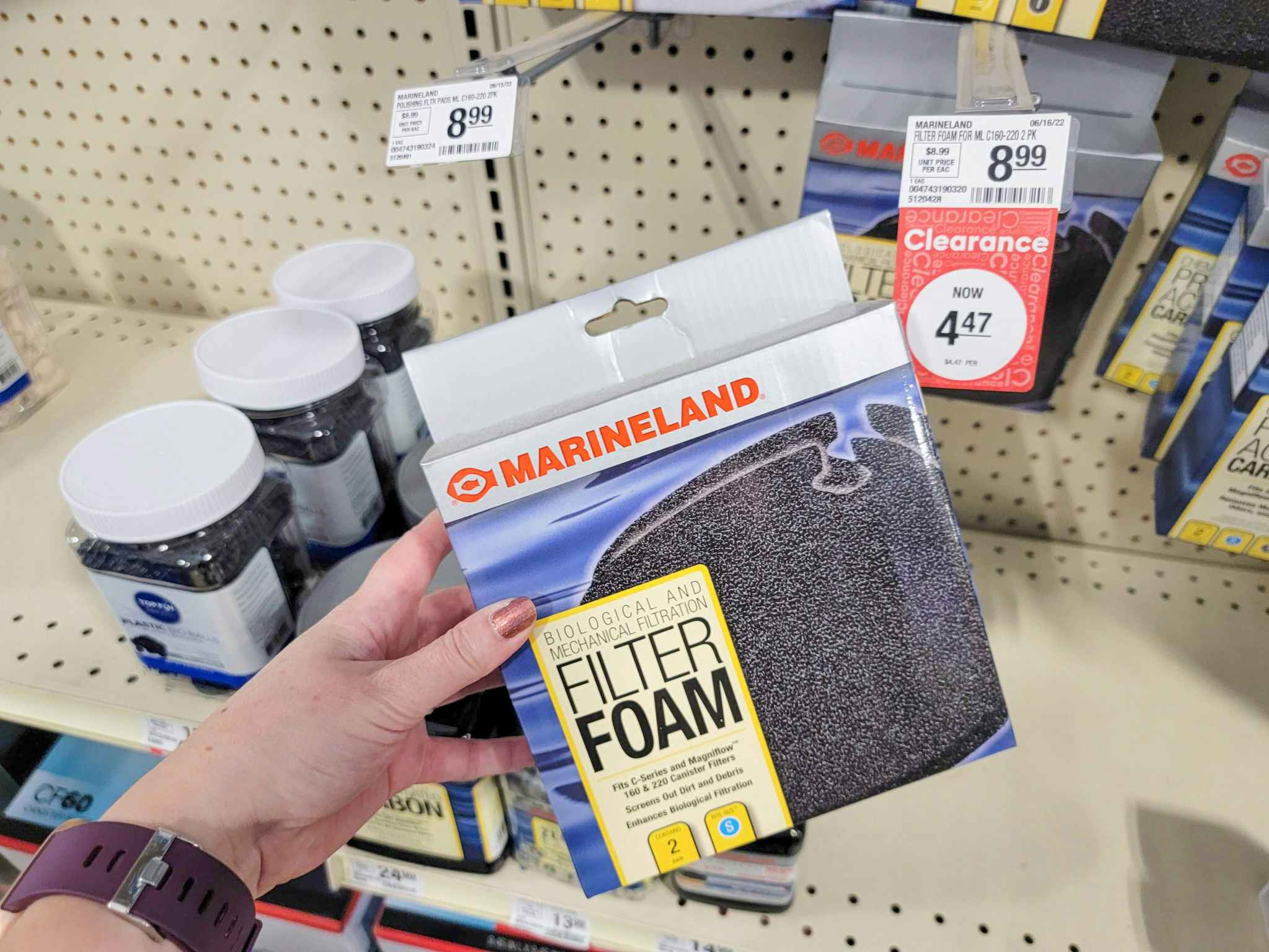hand holding a pack of filter foam for aquariums