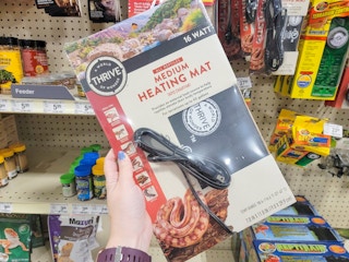 hand holding a medium reptile heating mat