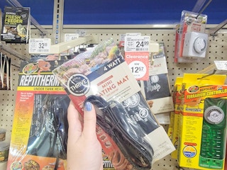 hand holding a mini reptile heating mat