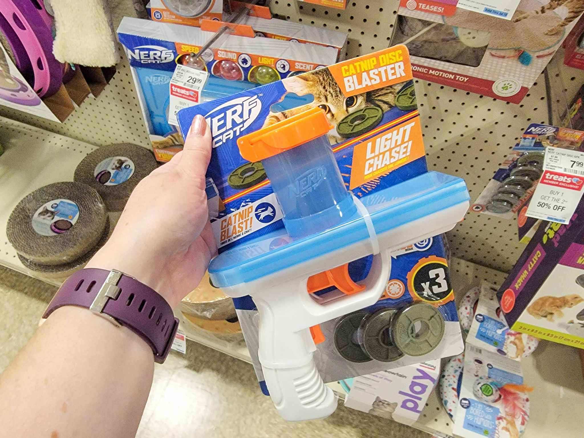 hand holding a nerf catnip blaster