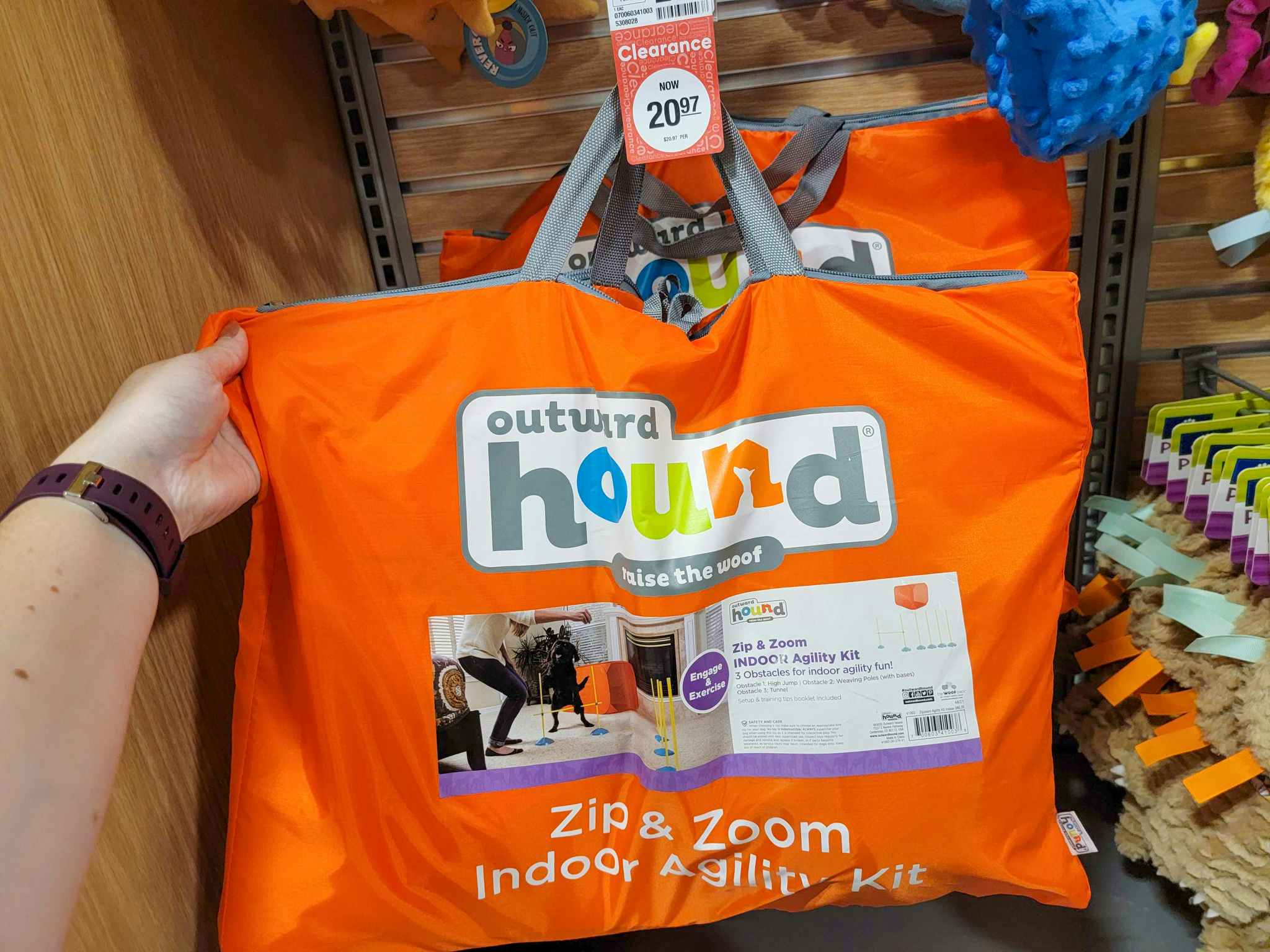 hand holding Outward Hound agility course dog play set at PetSmart