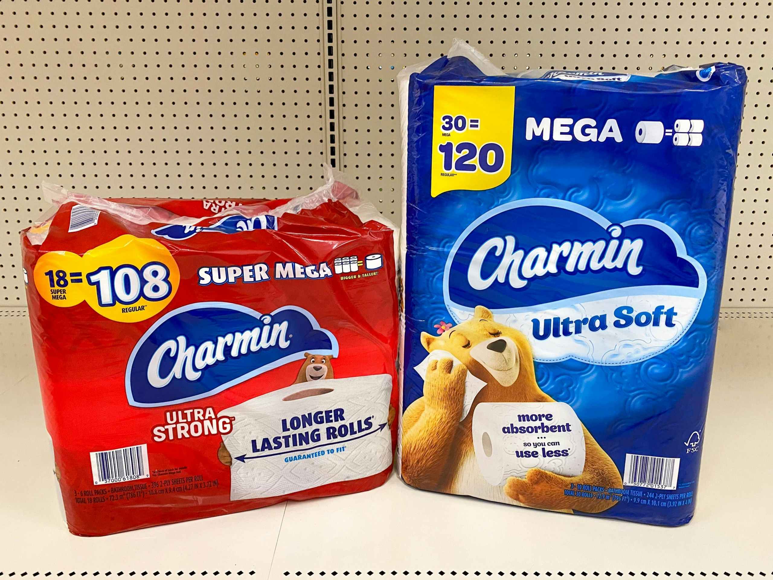 Two packages of Charmin toilet paper on store shelf