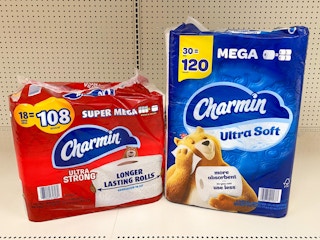 Two packages of Charmin toilet paper on store shelf