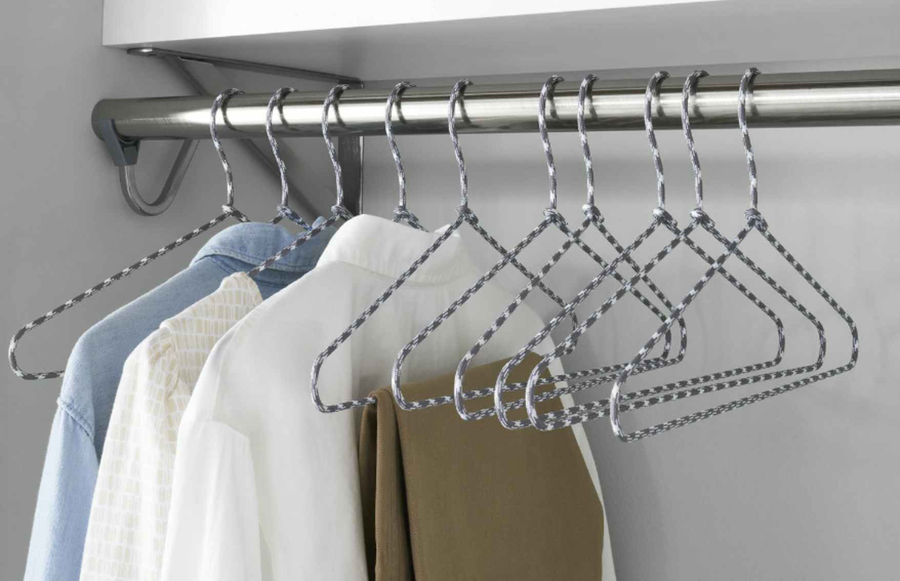 grey and white wire hangers in a closet