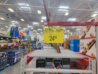 a sign showing a new lower price for bird feeders at Sam's Club