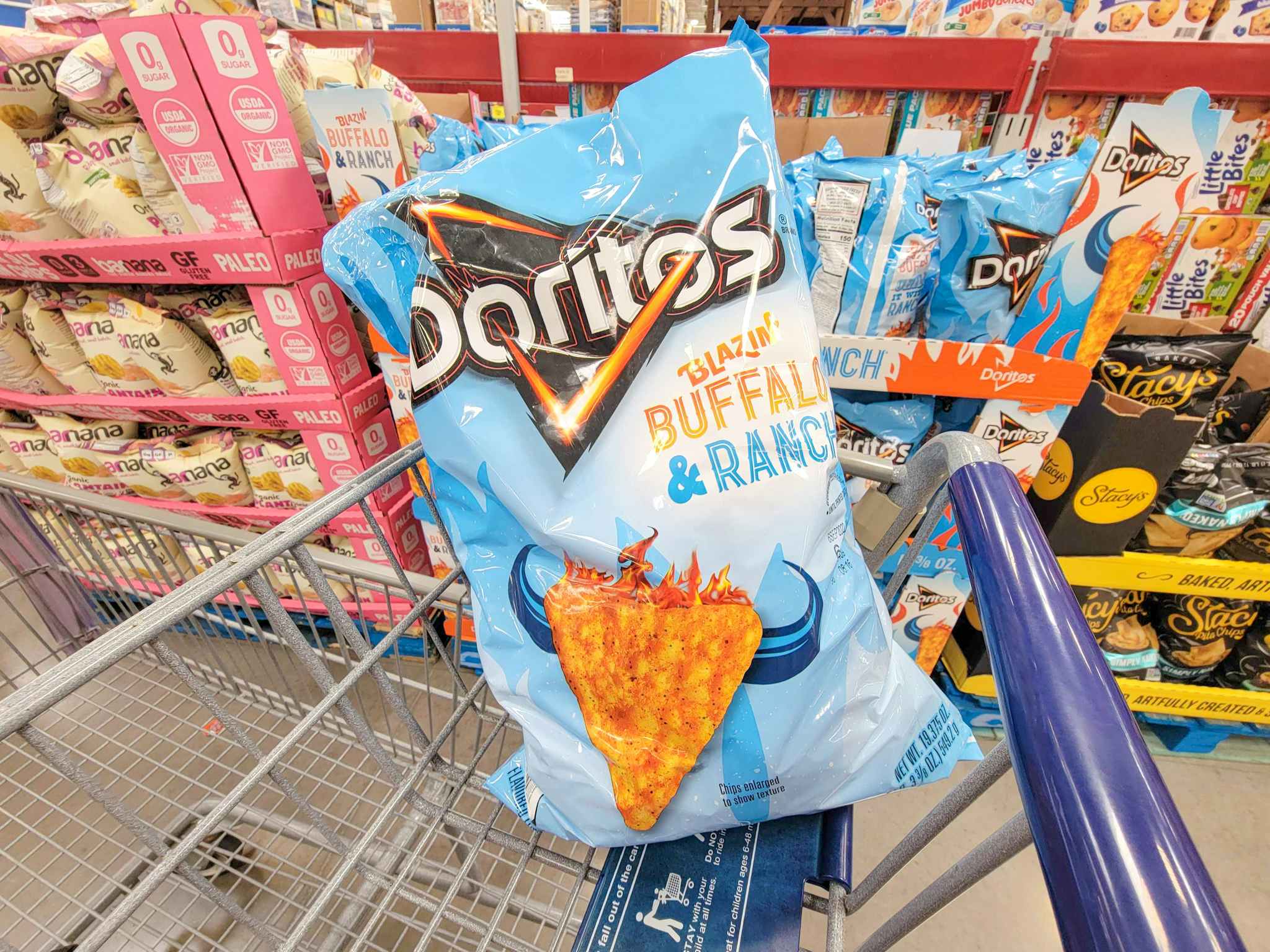 a bag of blazin buffalo and ranch doritos in a cart