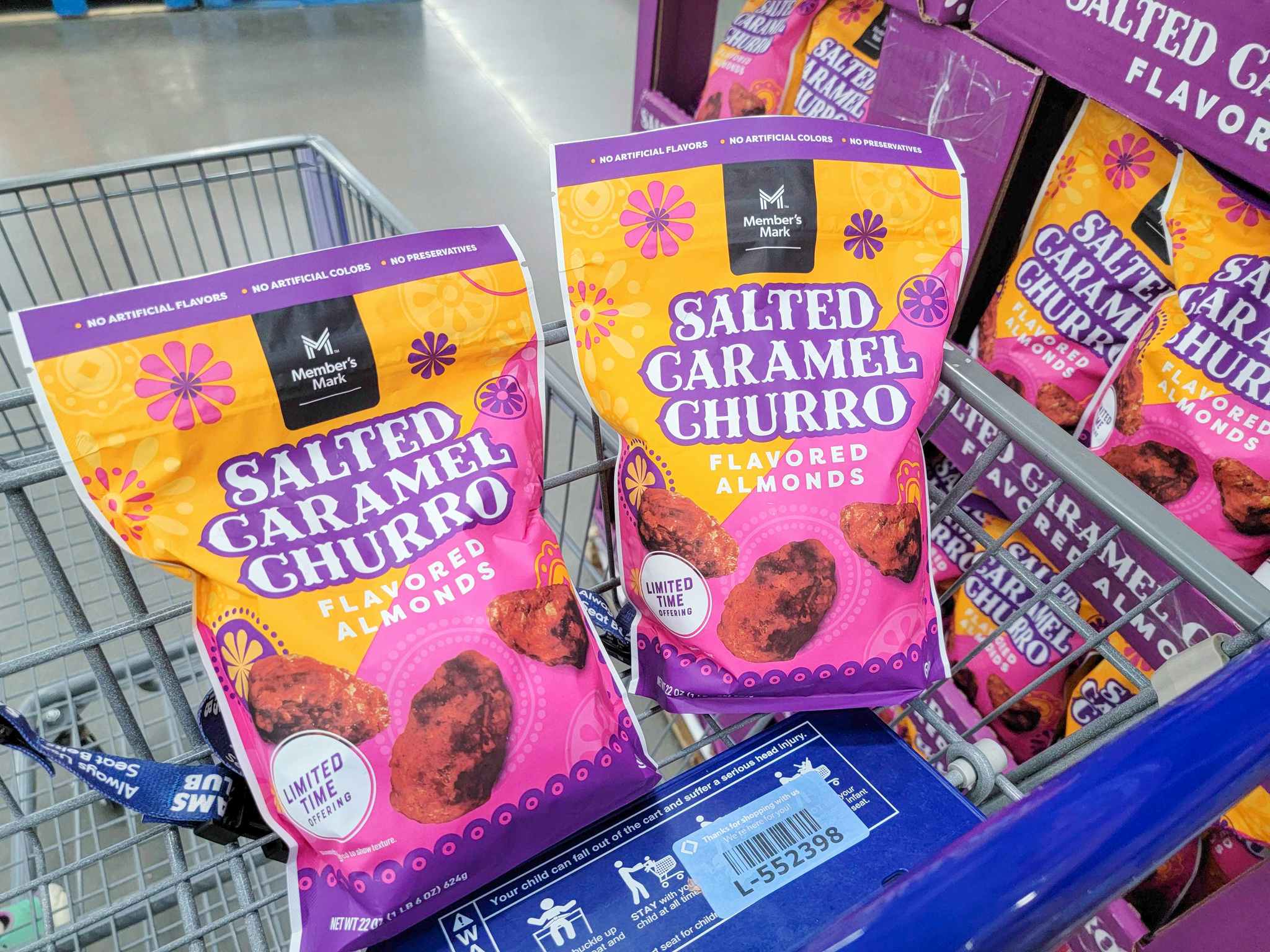 2 bags of salted caramel churro almonds in a cart