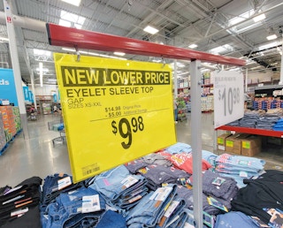 yellow sign for a new lower price on gap eyelet sleeve tops