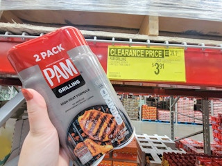 hand holding a 2-pack of Pam grilling spray by the clearance sign