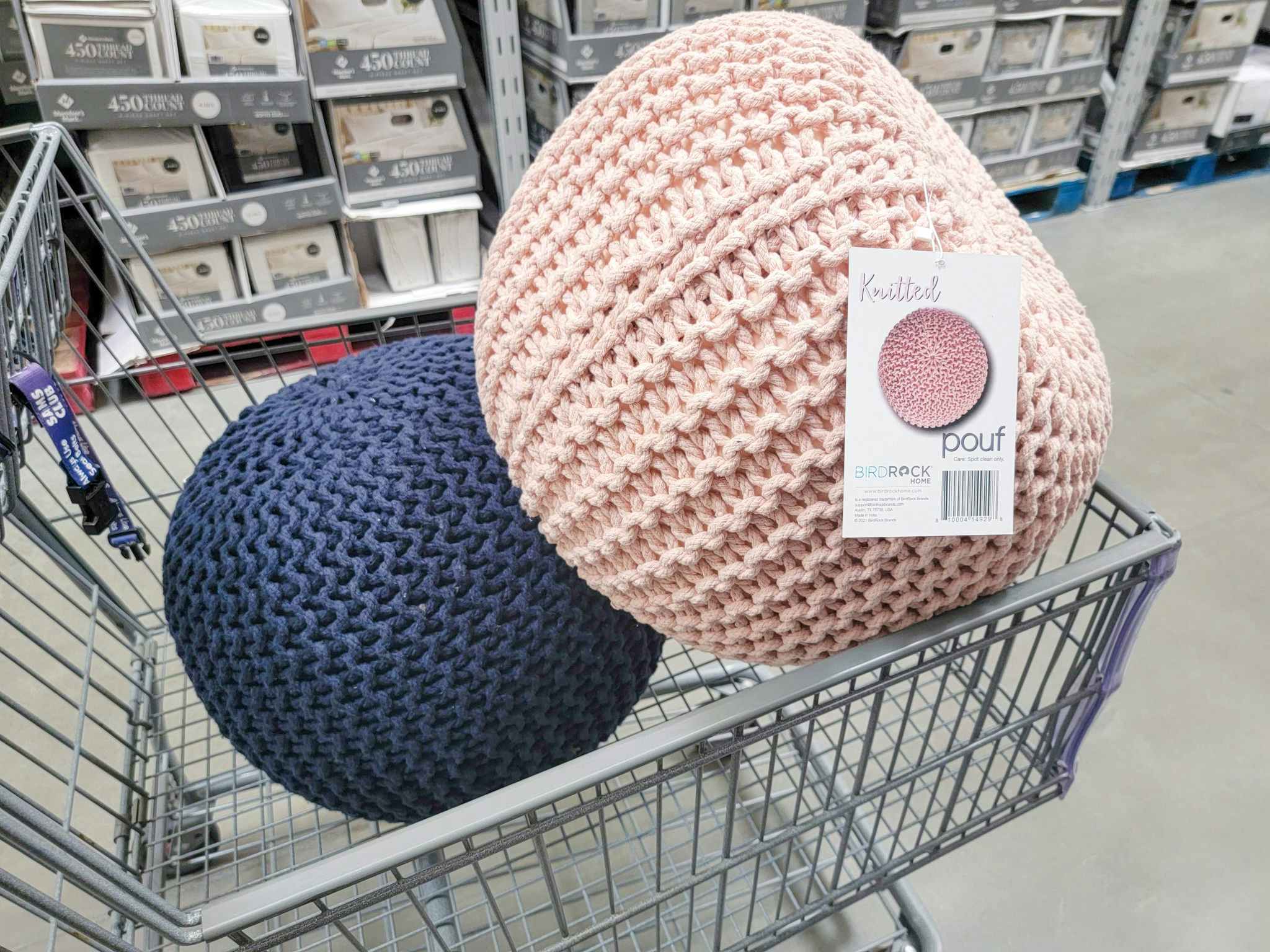 blue and pink knitted floor poufs in a cart