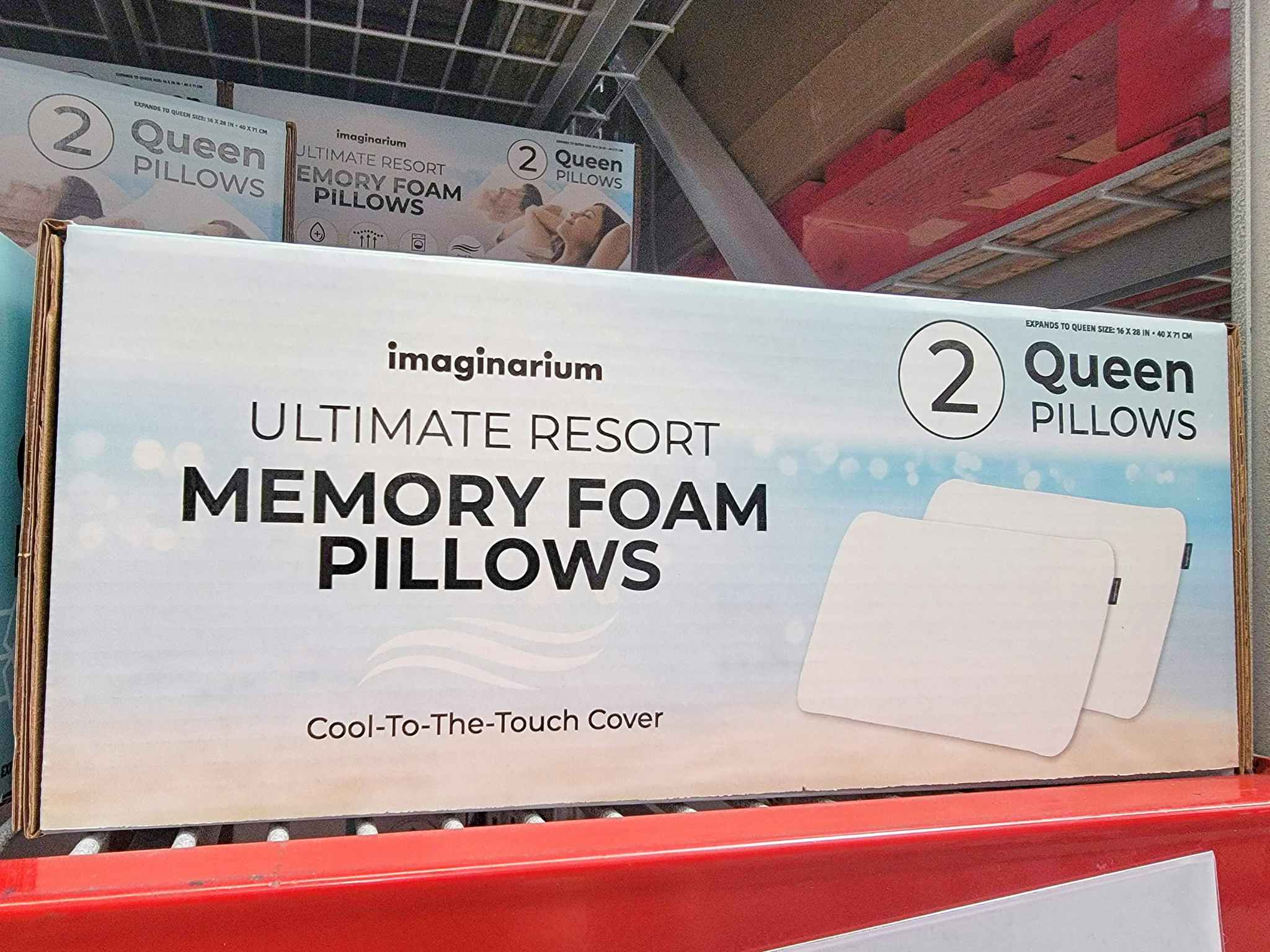 a box of two memory foam pillows on a shelf