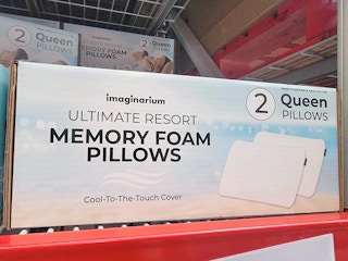 a box of two memory foam pillows on a shelf