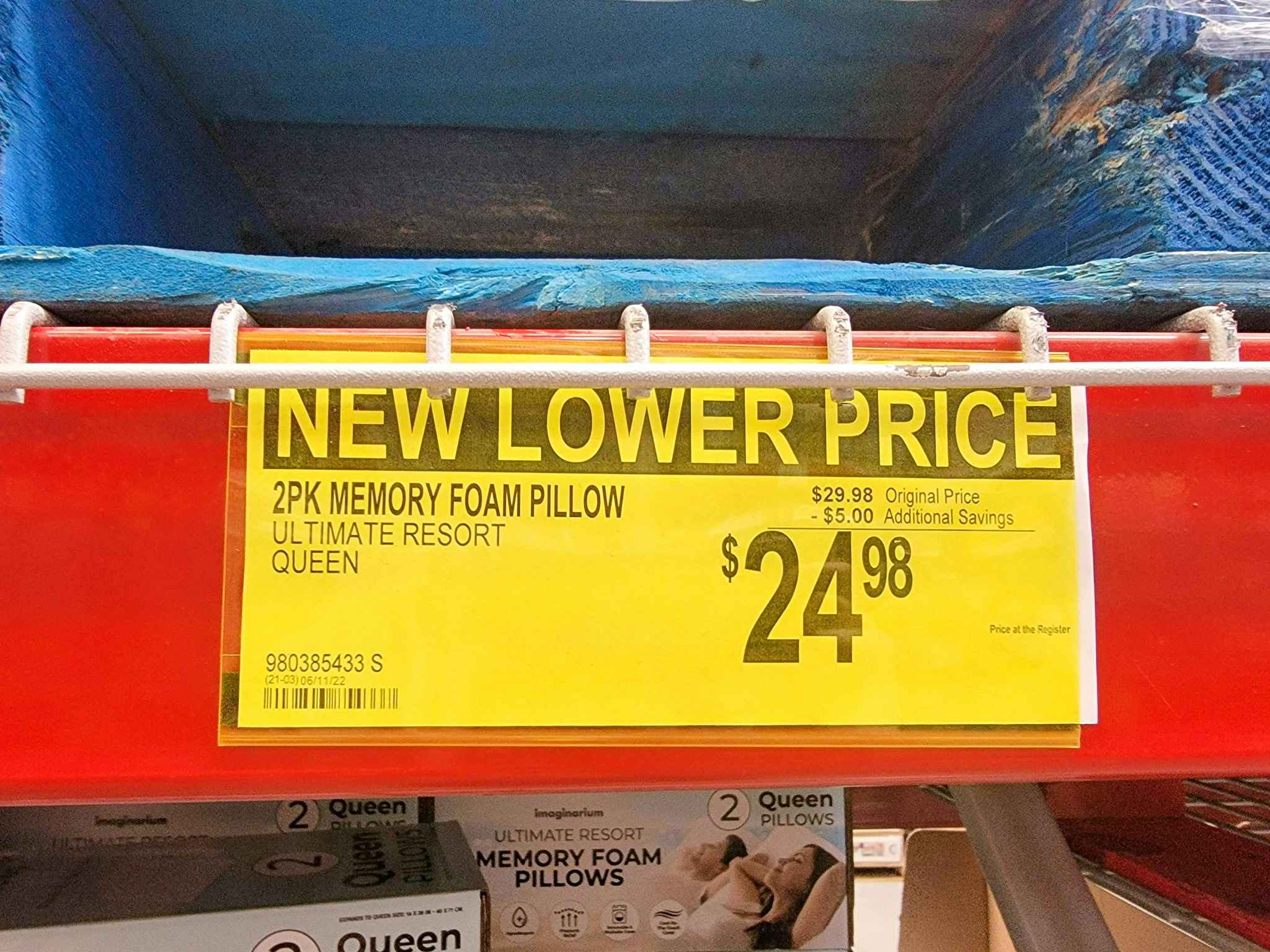 yellow sign for a new lower price on pillows