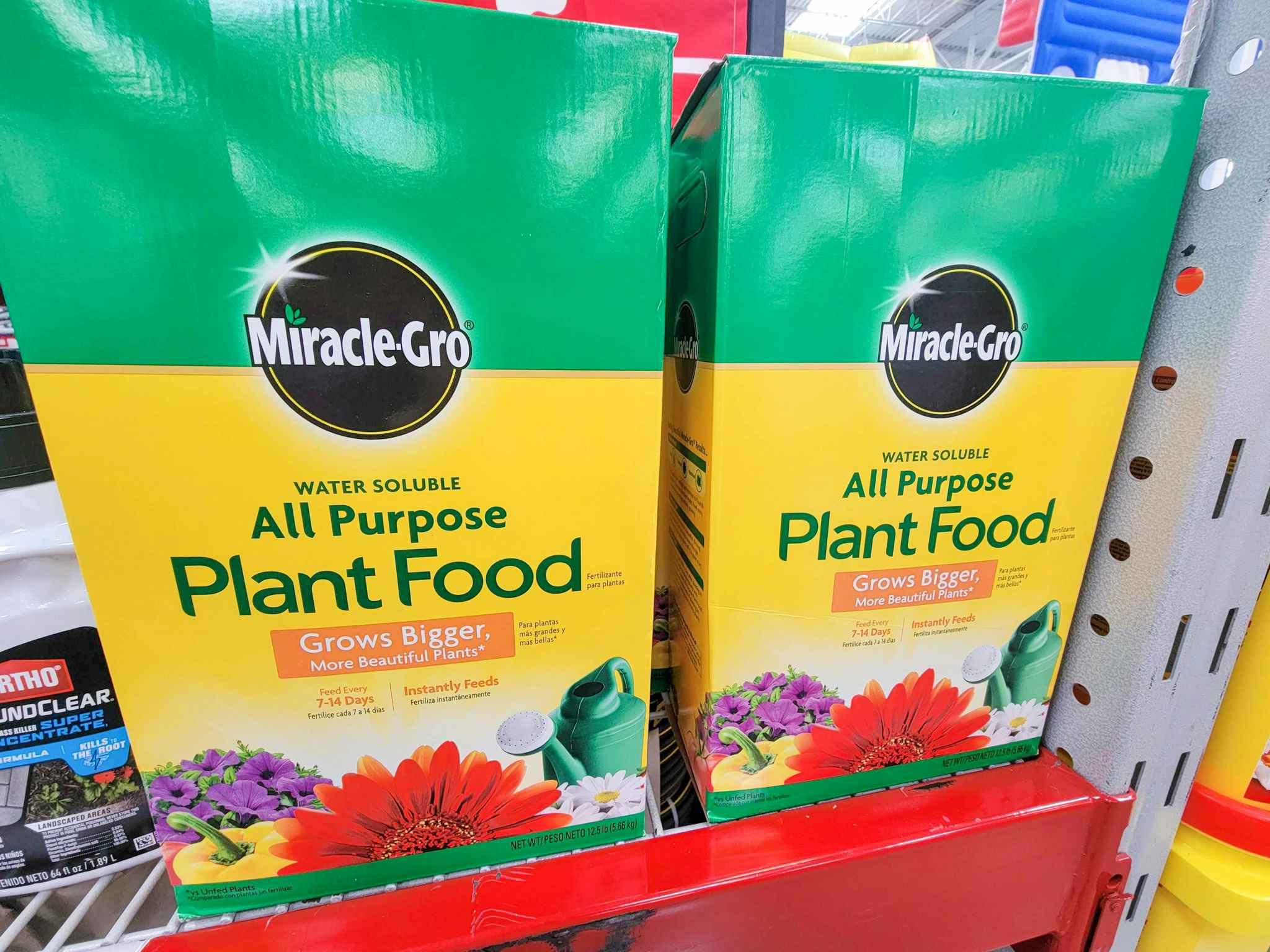 two large boxes of miracle gro plant food