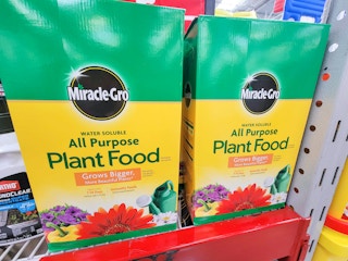 two large boxes of miracle gro plant food