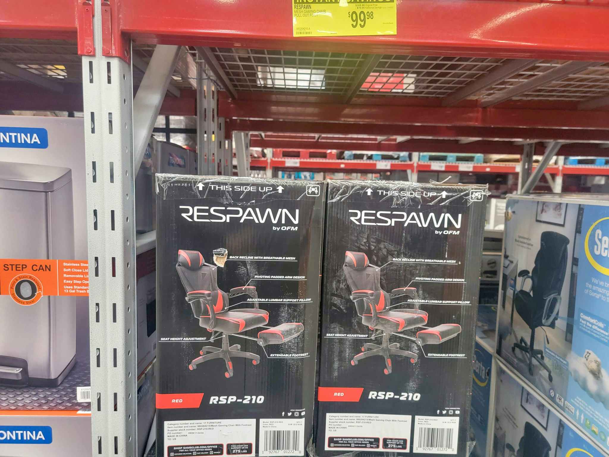 two respawn red and black gaming chairs in the boxes