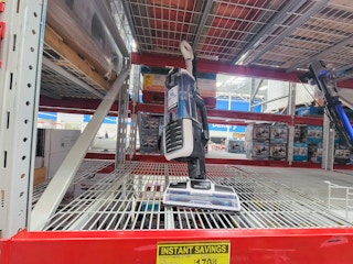 display of a shark rotator vacuum on a shelf
