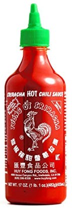 A stock image of a bottle of Huy Fong brand sriracha hot sauce.