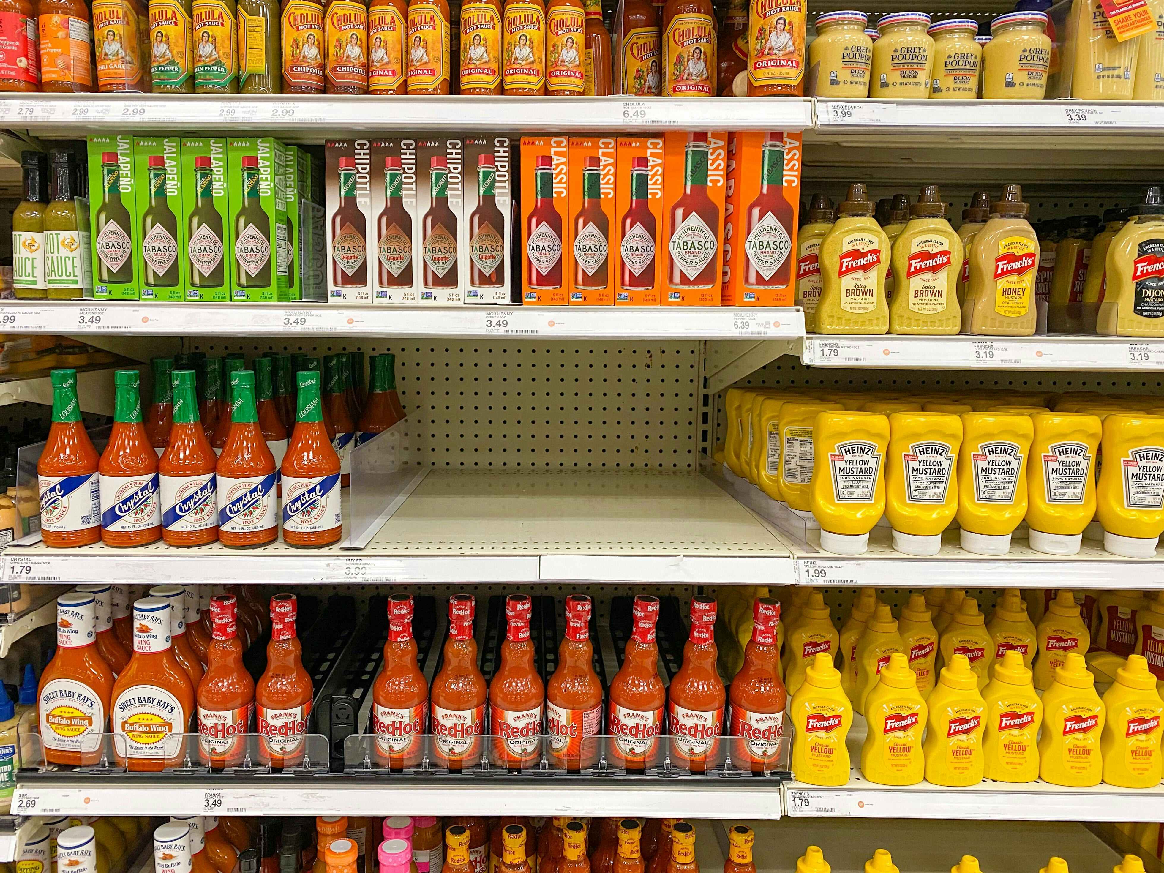 Target shelves showing full inventory for everything except Sriracha hot sauce