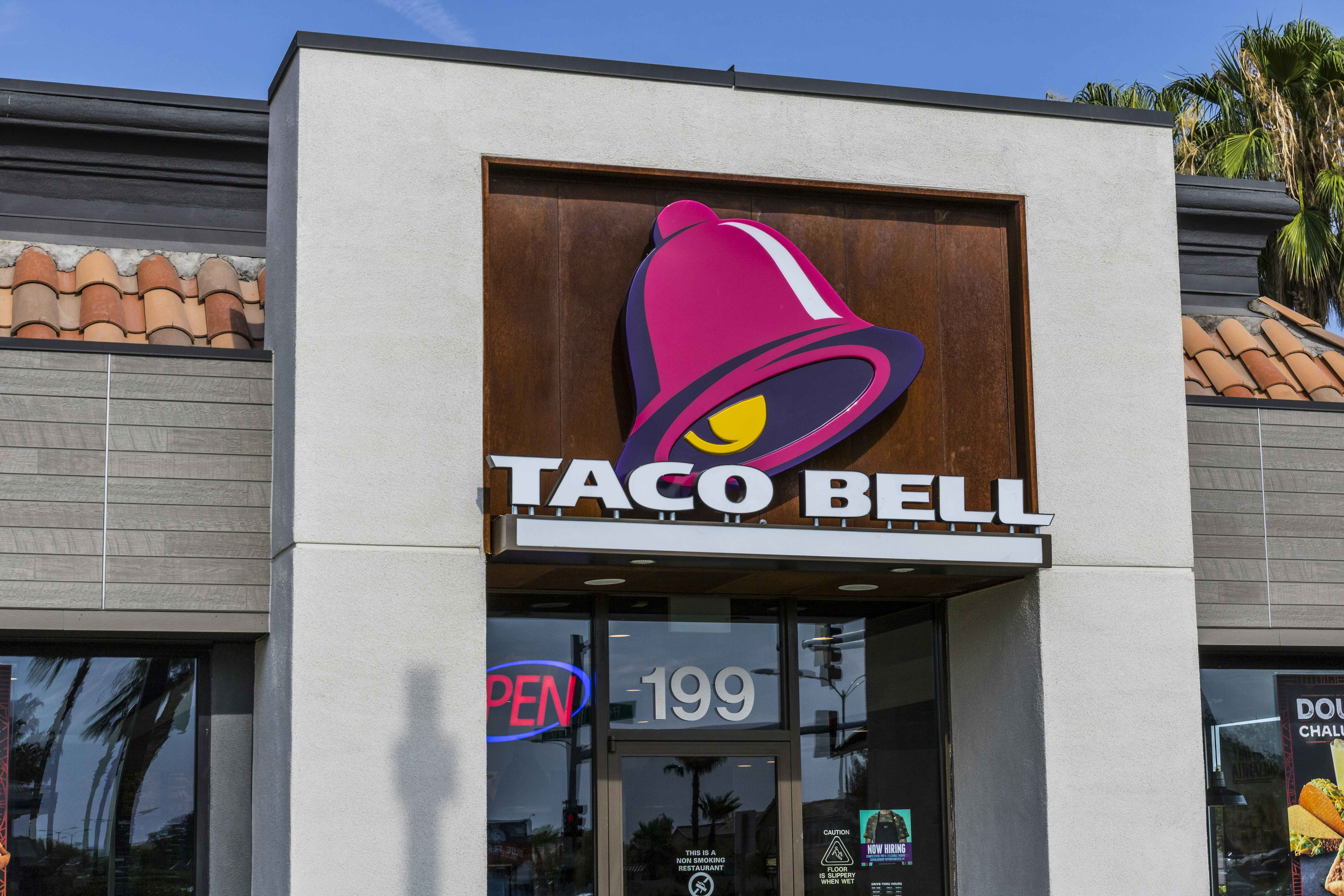 A Taco Bell restaurant storefront and sign.