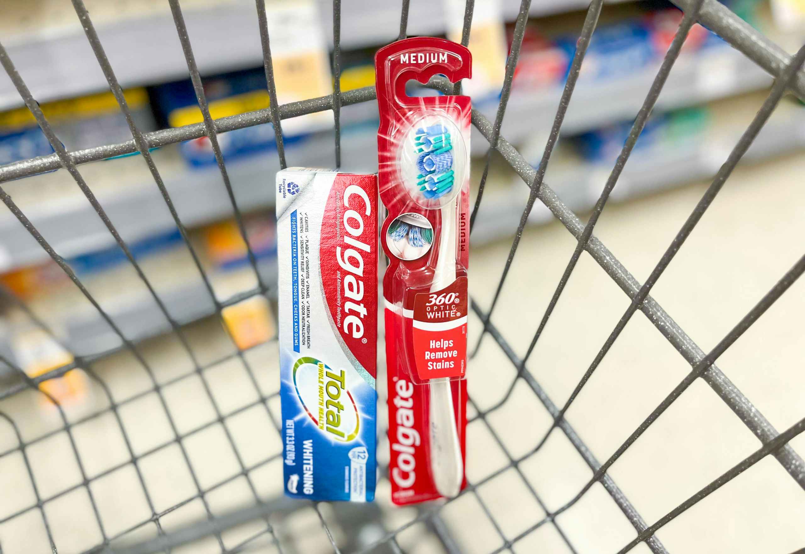 box of Colgate Total toothpaste and a Colgate Manual Toothbrush in cart