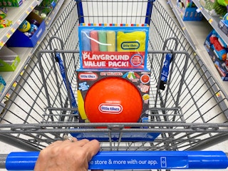 hand pushing walmart cart with little tikes playground value pack