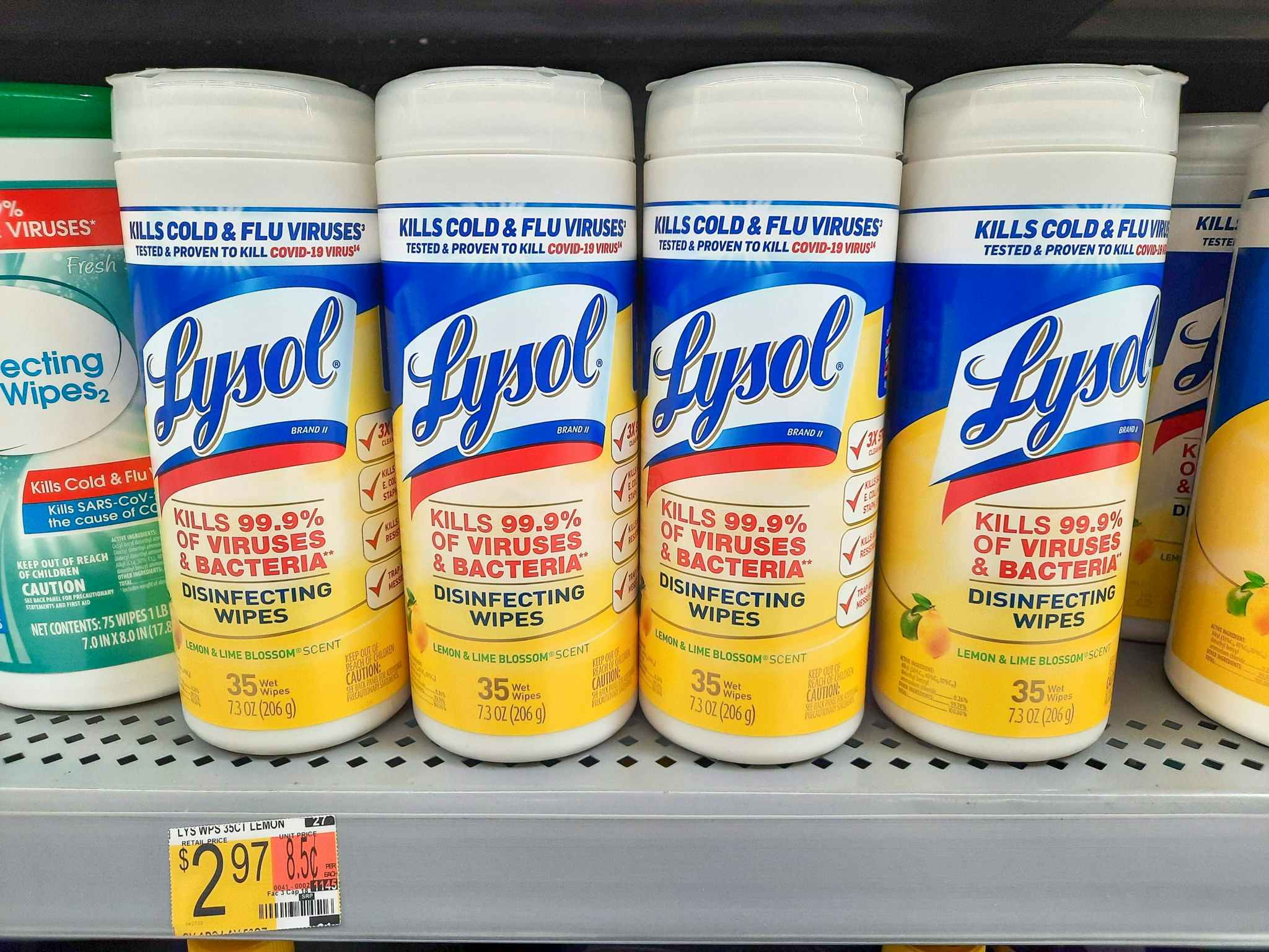 Lysol Disinfecting Wipes on display at Walmart. Sticker on shelf indicates the price is $2.97 per container.