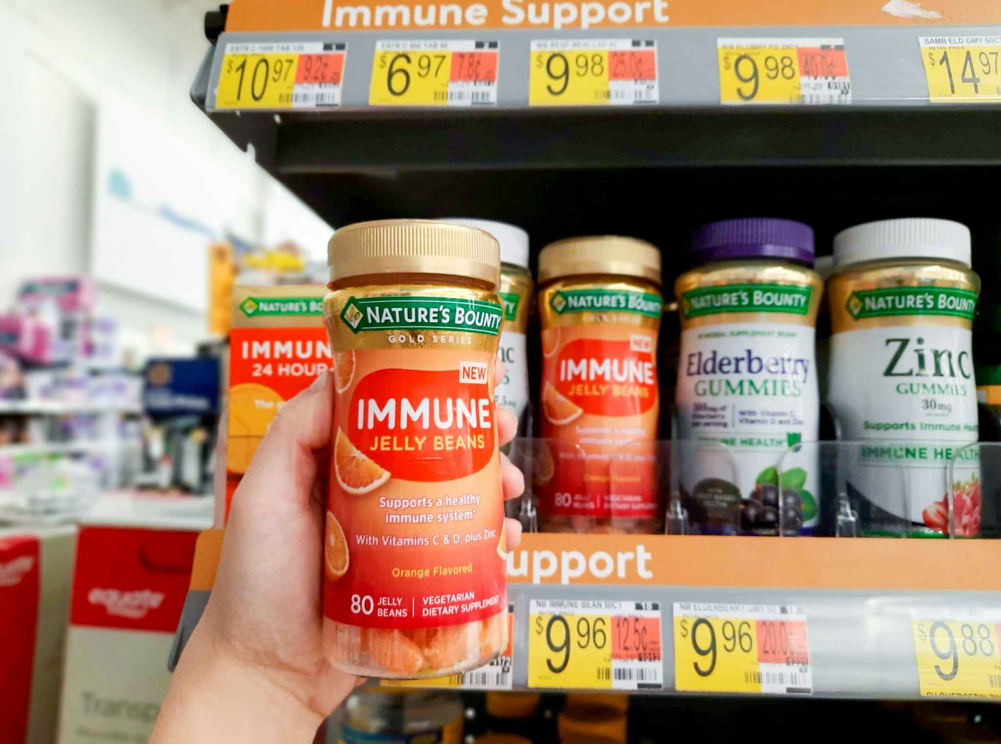 Nature's Bounty Immune Jelly Bean Vitamins held in front of shelf and $9.96 price tag at Walmart