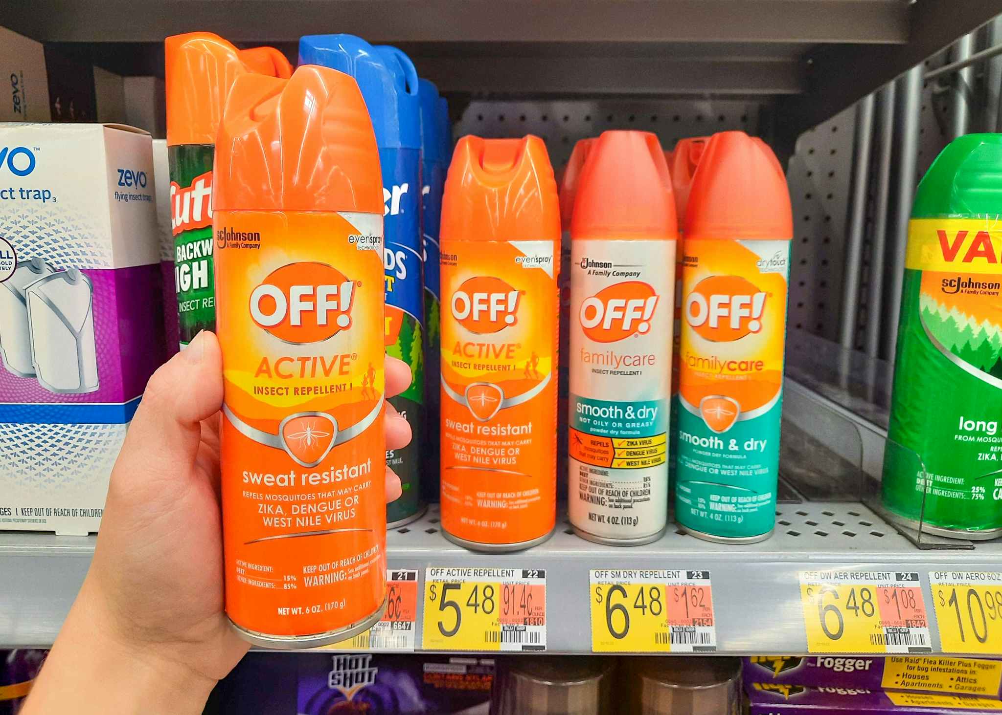 Off! Active Insect Repellent held in front of shelf at Walmart