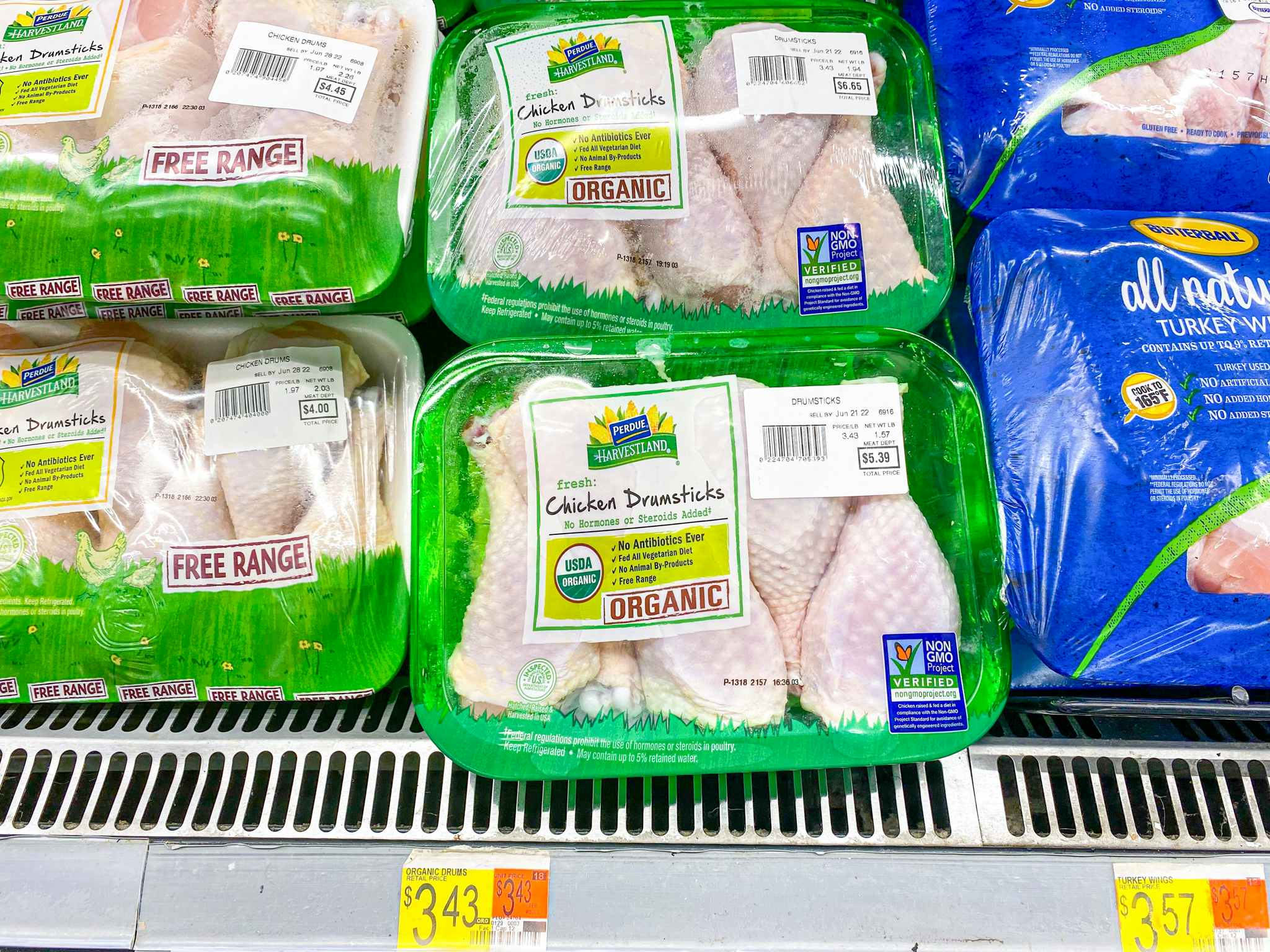 Perdue Harvestland Chicken Drumsticks on shelf at Walmart. Price sticker reads $3.43 per pound.