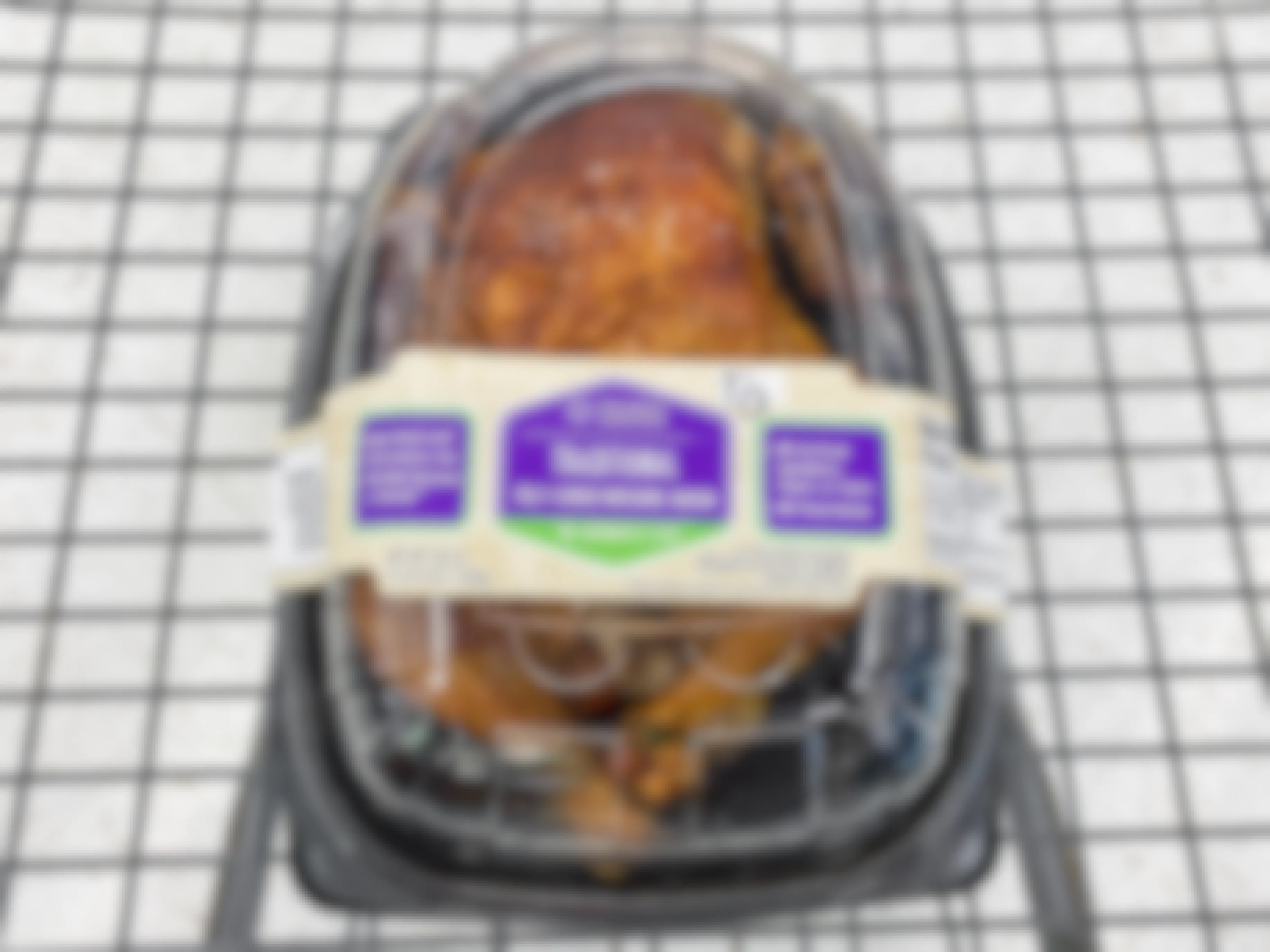 Walmart rotisserie chicken in a shopping cart.