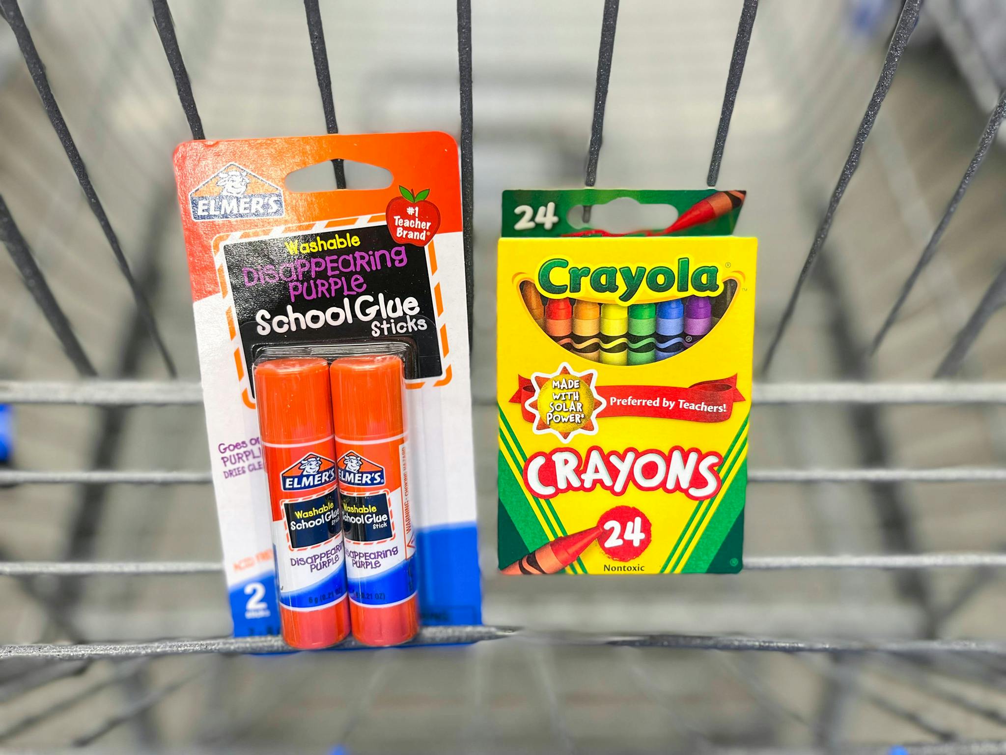 Elmers school glue sticks and crayola crayons in walmart shopping cart