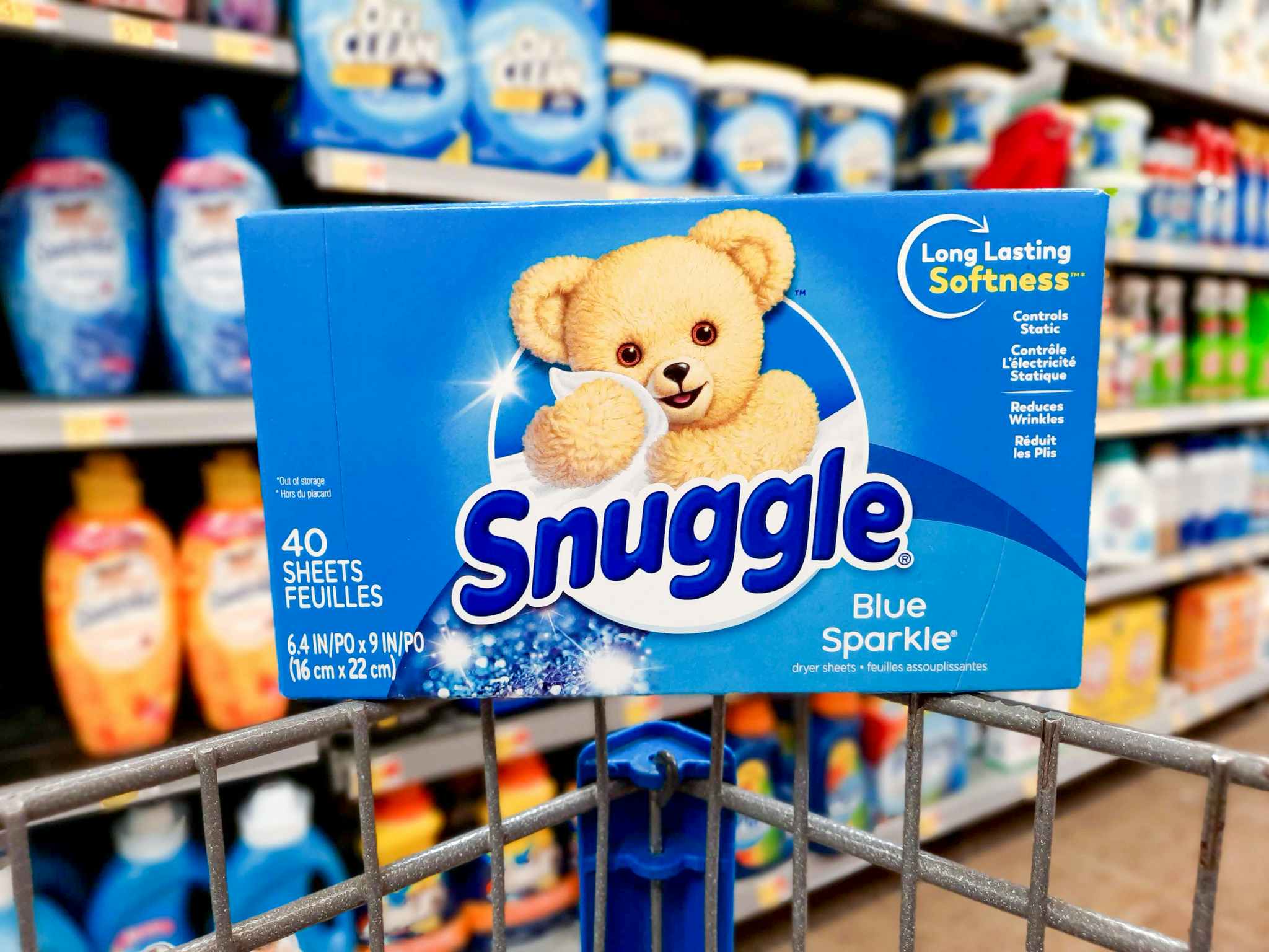 Snuggle Blue Sparkle Dryer Sheets balancing on the edge of a Walmart shopping cart