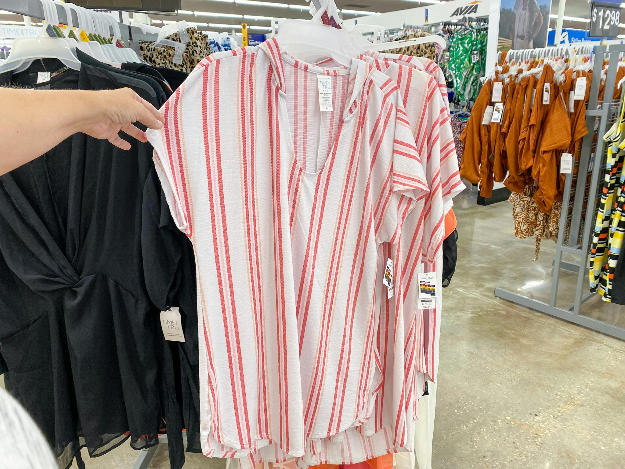 hand holding time and tru waffle cover up at walmart