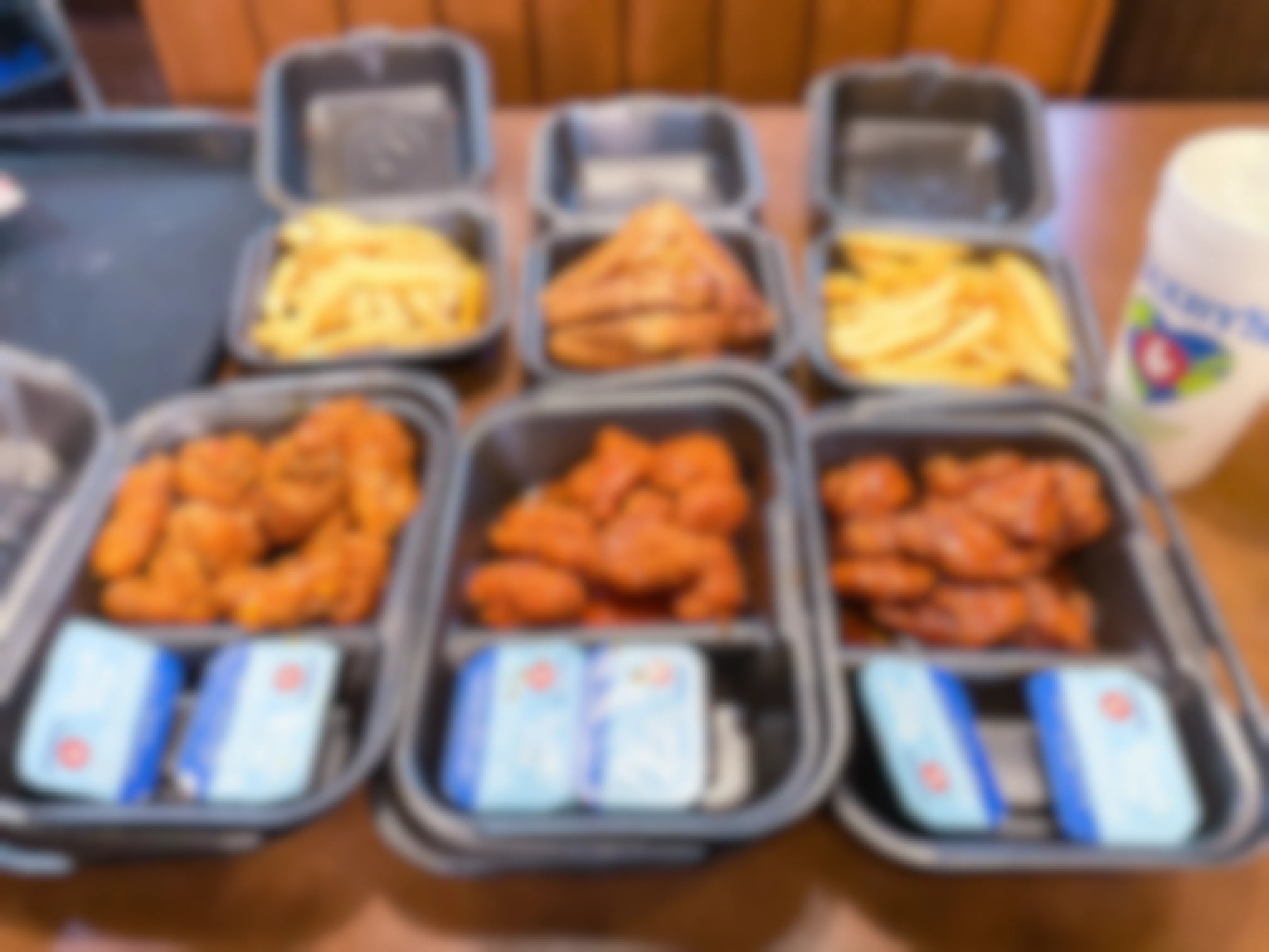 open takeout boxes of zaxby's BOGO boneless wings meals